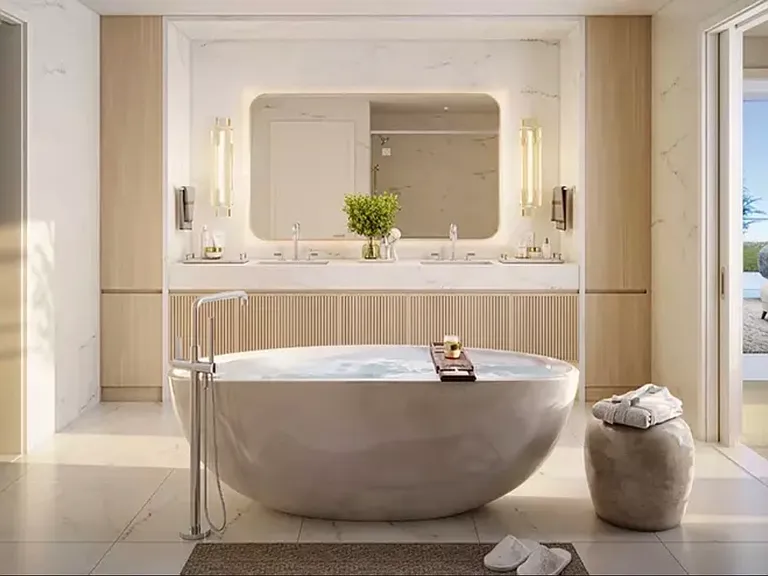 Spa-inspired primary bath with soaking tub and marble